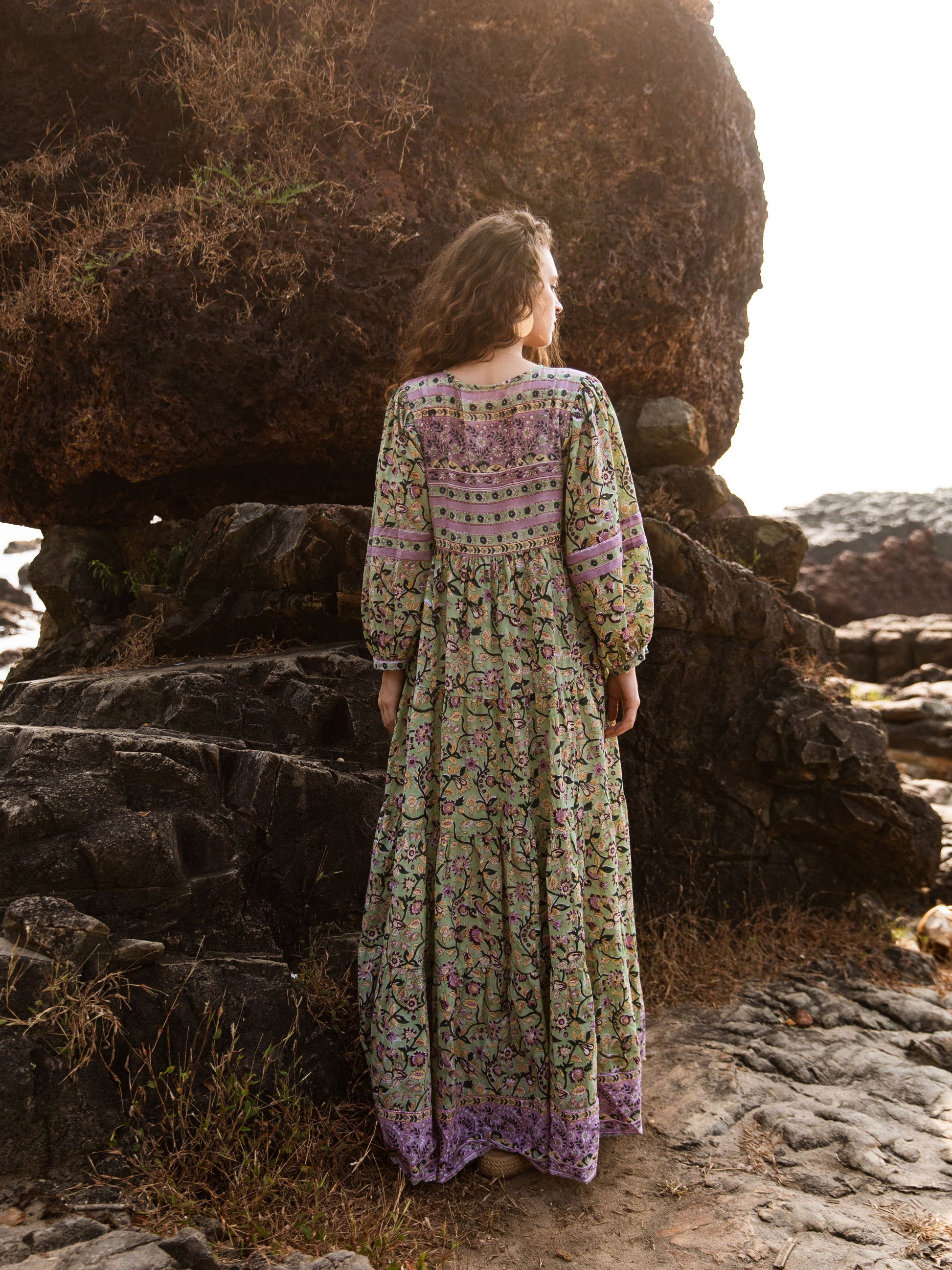 Back view of the Ubek Bohemian Dress as the model looks out to sea